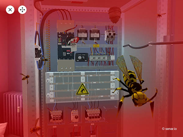 scène en réalité augmentée d'une intervention sur une armoire électrique avec une attaque de guêpe